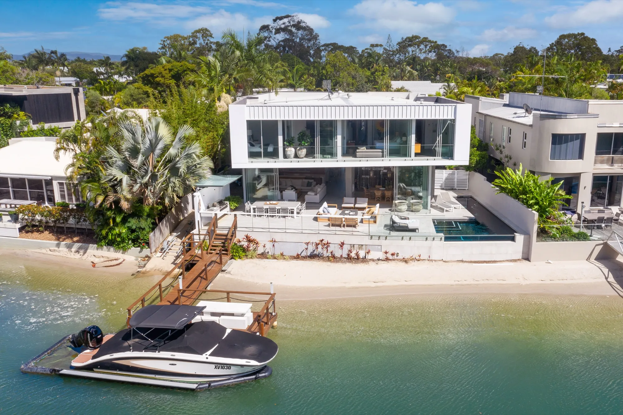 Rear exterior and waterfront garden