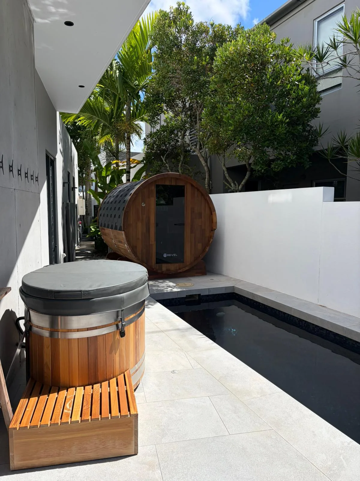 Cedar barrel sauna hut on the poolside terrace