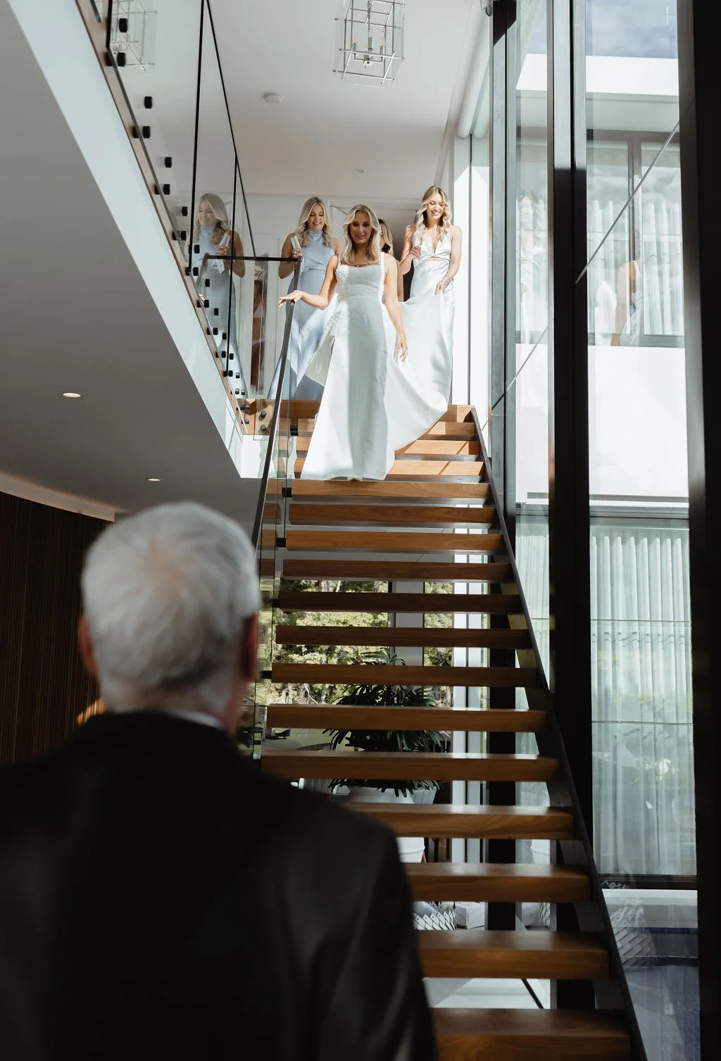 Bride descending the staircase to meet her father
