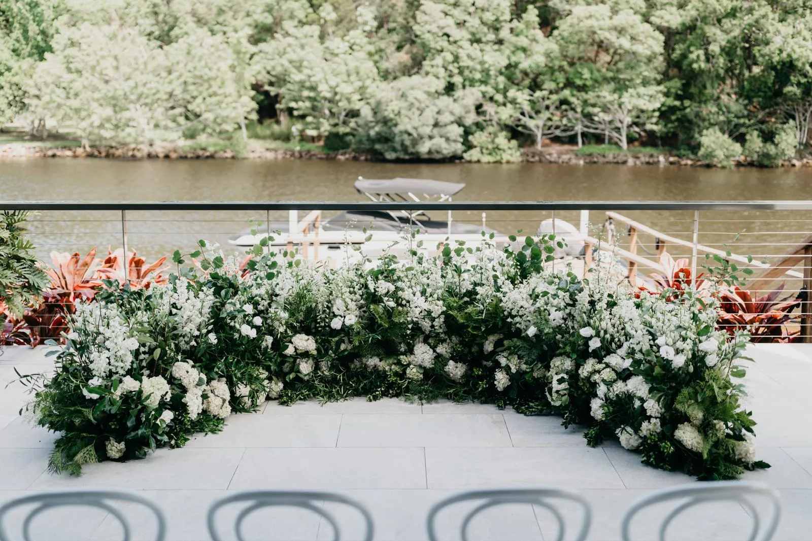 White and green floral arrangements ready for the ceremony